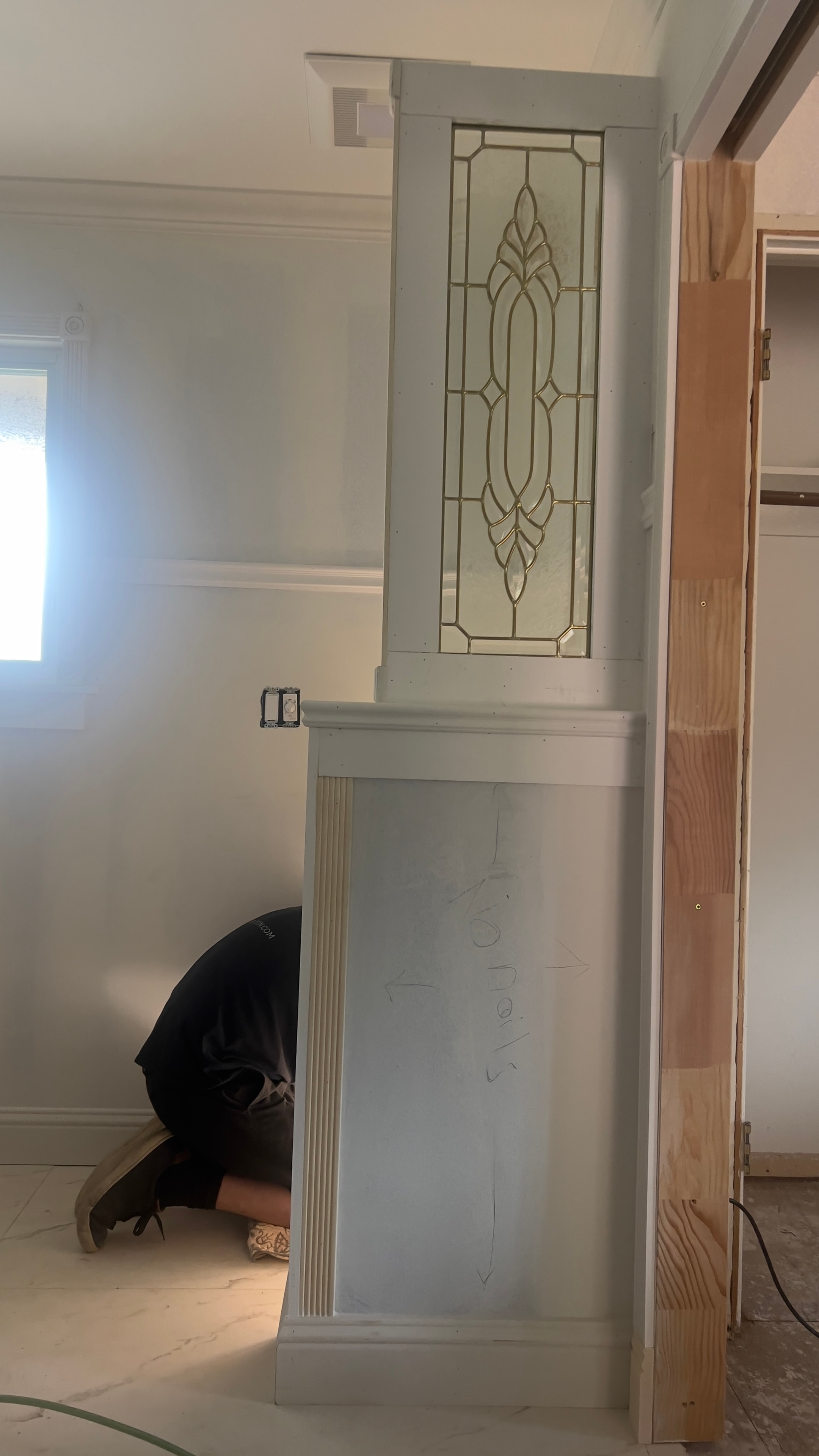 Custom decorative glass door with geometric pattern and millwork trim — GT Home Solution design in Amador County, CA