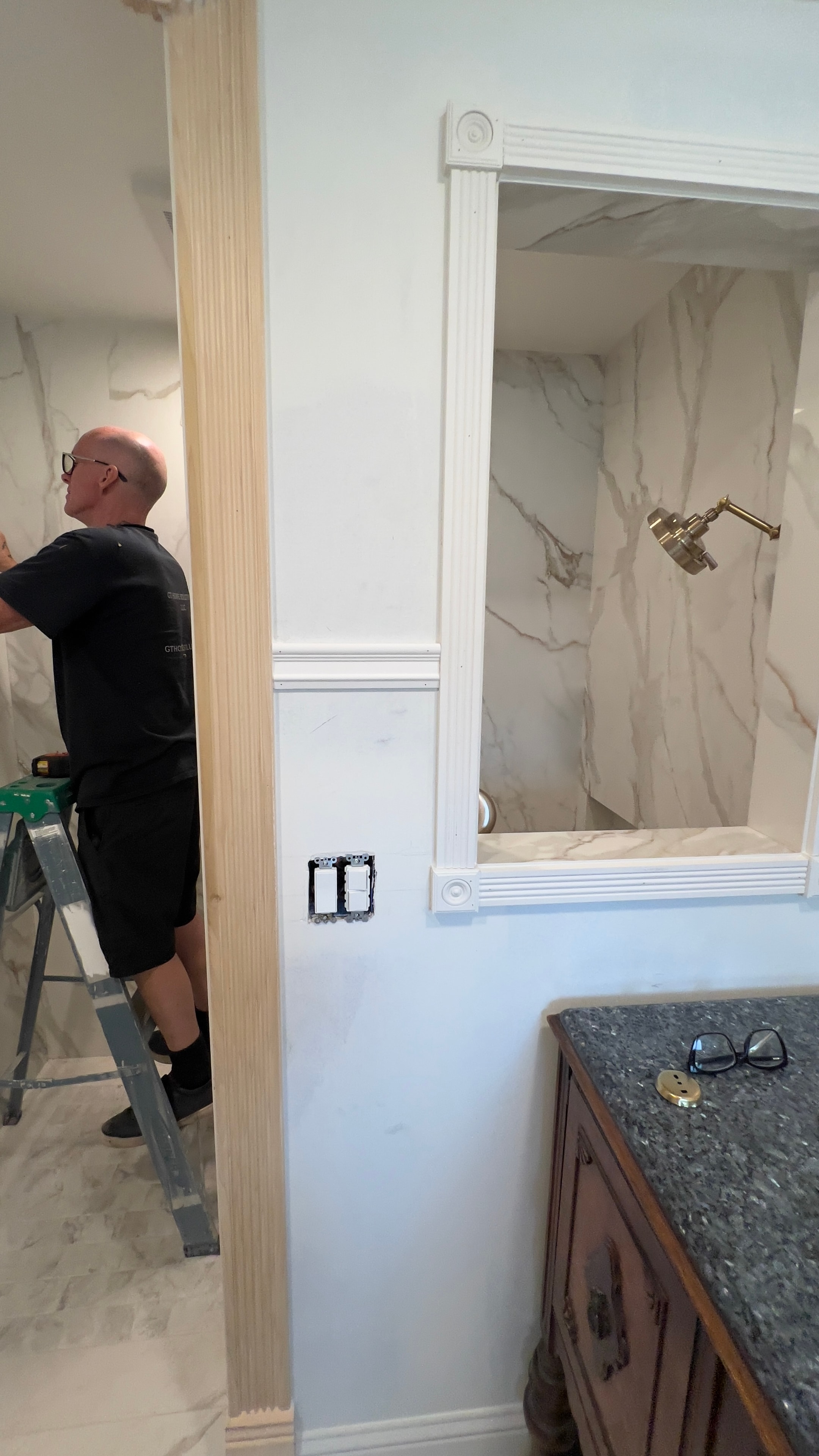 Worker installing custom bathroom shower enclosure with tile surround — GT Home Solution in Amador County, CA