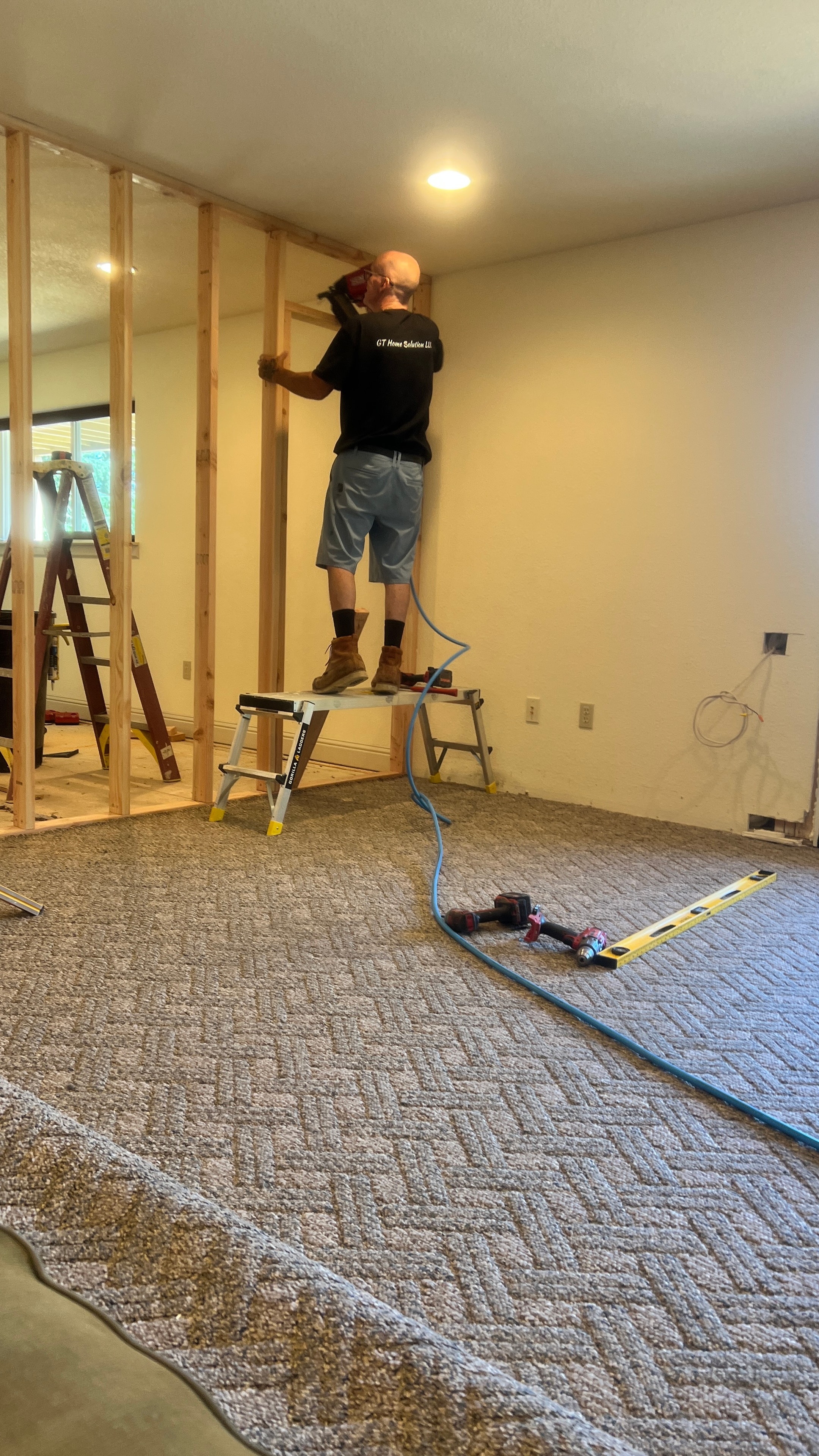 GT Home Solution crew member framing interior walls during a custom design build — Amador County, CA