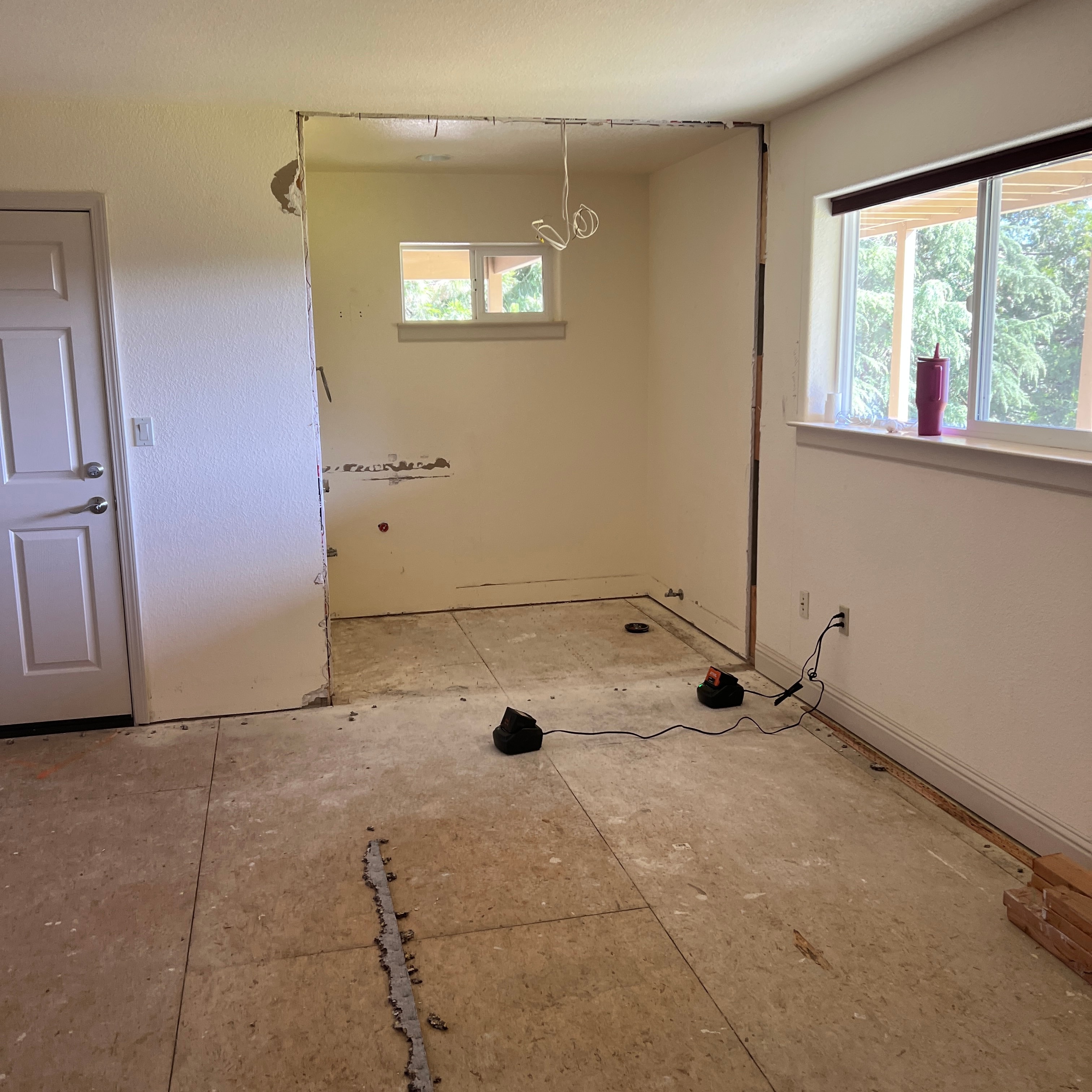 Interior bathroom fully gutted with walls opened and subfloor exposed — GT Home Solution custom renovation in Amador County, CA
