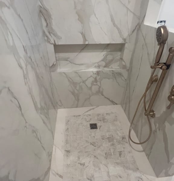 Floor-to-ceiling porcelain panel walk-in shower with rainfall showerhead and frameless glass — GT Home Solution bathroom renovation in Placerville, CA